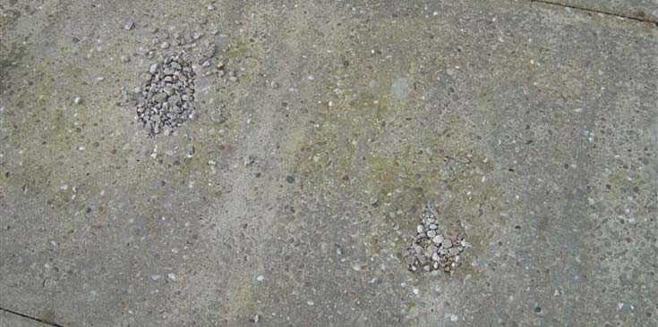 Cracked and extremely worn concrete base.